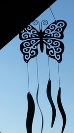 Low angle view of tree against blue sky