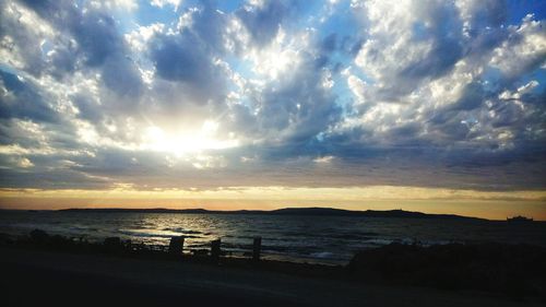 Scenic view of calm sea at sunset