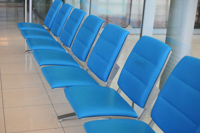 High angle view of chairs in swimming pool