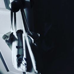 High angle view of electric lamp hanging on metal
