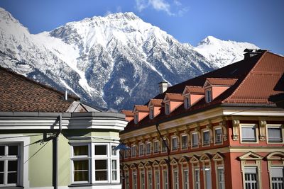 Houses on snow covered mountain