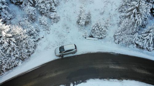 High angle view of car on snow covered land