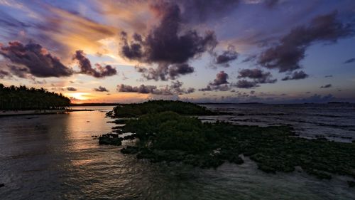 Scenic view of sea against sky at sunset