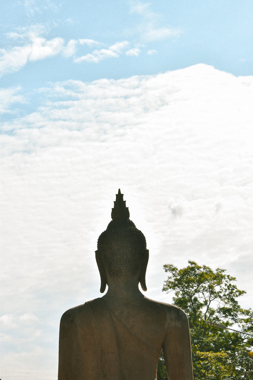 sky, cloud - sky, human representation, statue, day, male likeness, representation, art and craft, spirituality, sculpture, tree, nature, religion, architecture, no people, belief, outdoors, creativity, idol