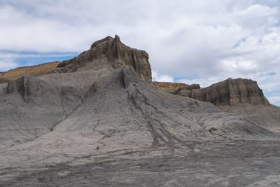 Desert landscape of barren grey hillsides near hanksville, utah