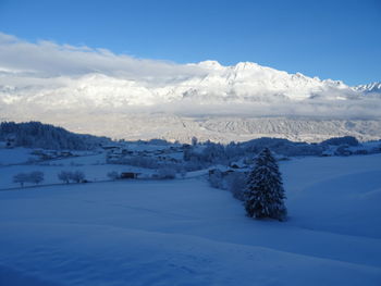 Scenic view of snowcapped mountains against sky