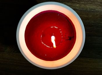 Directly above shot of red candle on table