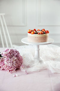 Cake and flowers on table during celebration