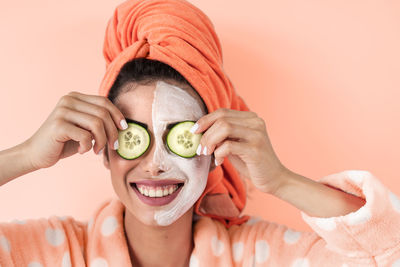 Portrait of a smiling young woman wearing mask