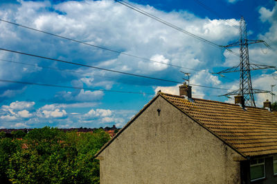 Low angle view of built structure against cloudy sky