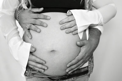 Midsection of doctor examining patient