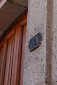 Low angle view of text on wall of building