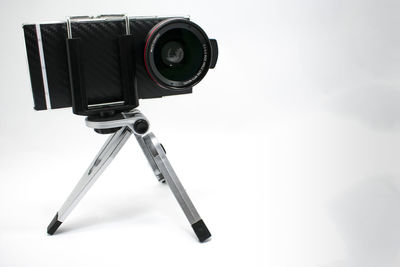 Close-up of camera against white background