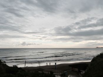 Scenic view of sea against cloudy sky