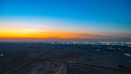 High angle view of cityscape against sky during sunset