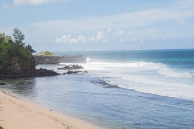 Scenic view of beach against sky