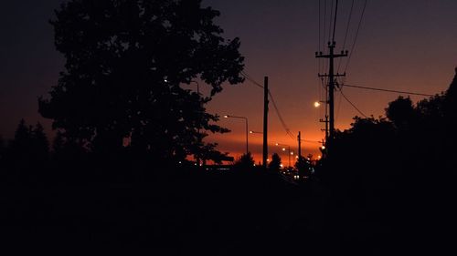 Silhouette trees against sky during sunset