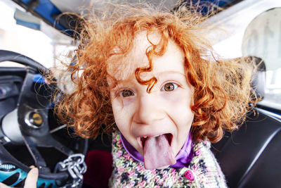 Portrait of happy woman in car