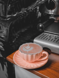 Close-up of coffee cup on table