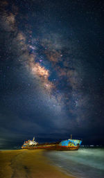 Scenic view of sea against sky at night