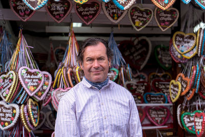 Portrait of smiling man standing at market