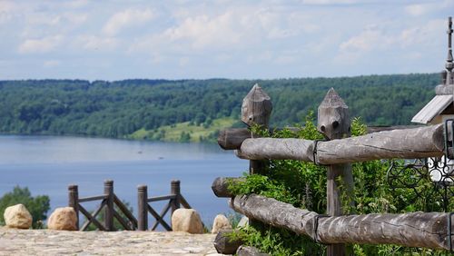 Scenic view on volga river and wooden railing from a hill