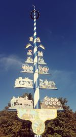 Low angle view of christmas tree against sky