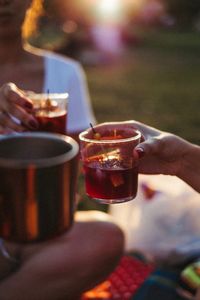 Close-up of hand holding wineglass