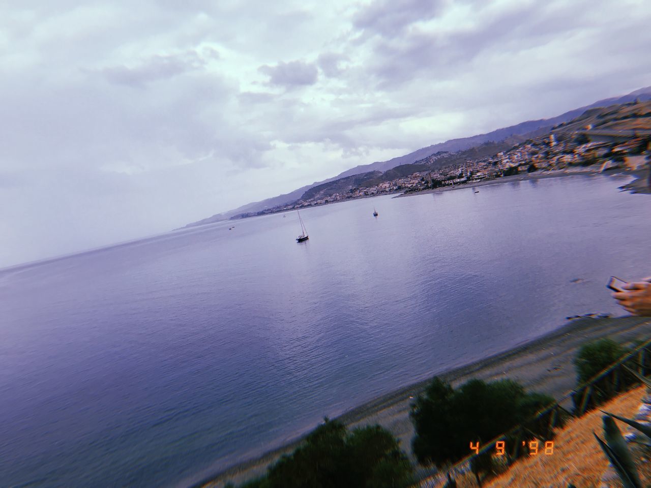 SCENIC VIEW OF SEA AND BAY AGAINST SKY