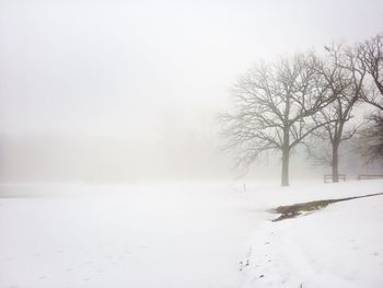 Snow covered landscape against sky