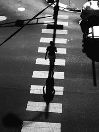 High angle view of person crossing road