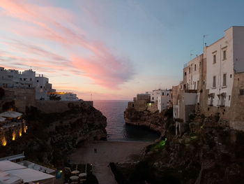 Houses in city at sunset