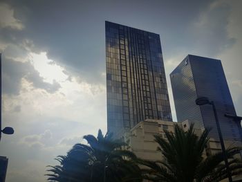 Low angle view of skyscrapers against sky