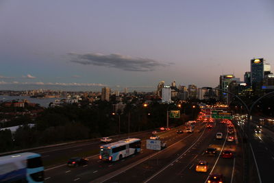 High angle view of illuminated street amidst buildings in city