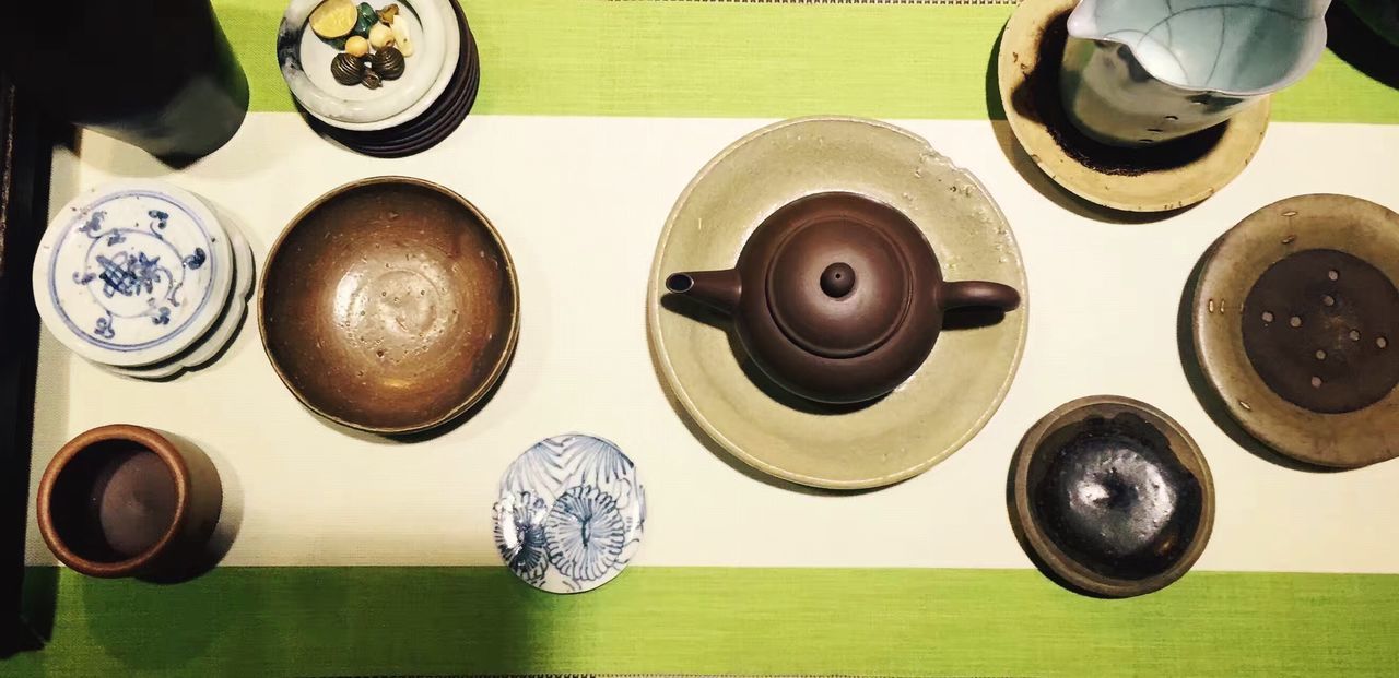 HIGH ANGLE VIEW OF OBJECTS ON WOODEN TABLE