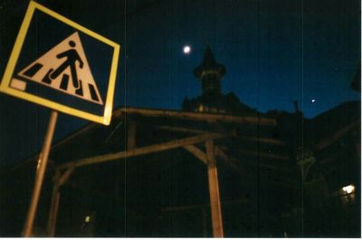 Low angle view of illuminated street light at night