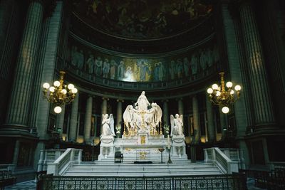 Low angle view of illuminated statue in temple