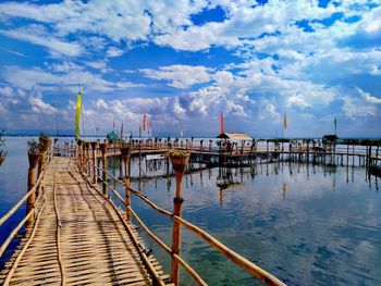 Pier on sea against sky