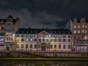 Buildings in city at night