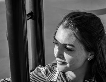 Close-up of woman looking through window