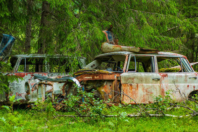 Abandoned car on field