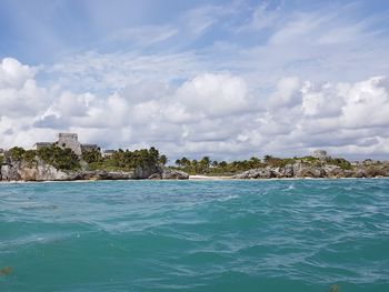 Panoramic view of tulum from sea against sky