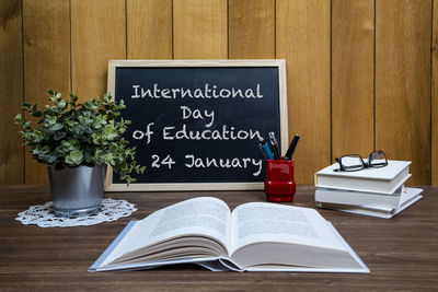 The representation of the international day of education with books and a notebook on a table