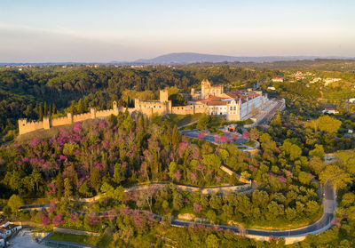 Aerial drone view of convento de cristo christ convent in tomar at sunrise, portugal