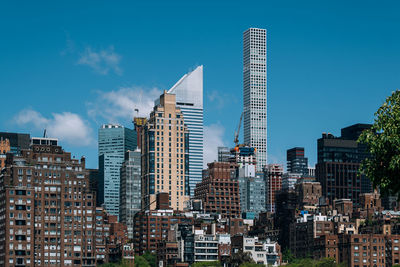 Low angle view of buildings against blue sky