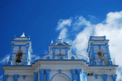 Low angle view of built structure against blue sky