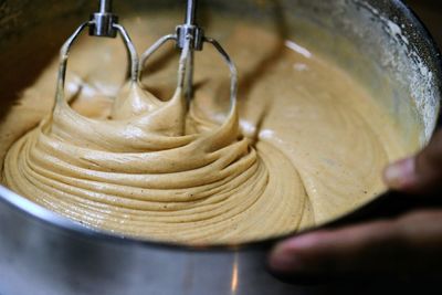 Close-up of person preparing food in bowl