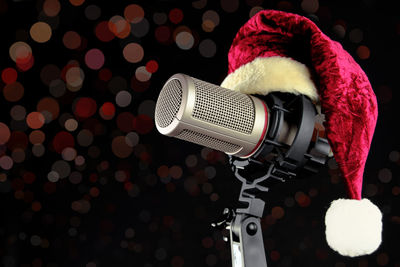 Close-up of santa hat on microphone against defocused background