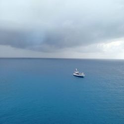 High angle view of cruise ship against cloudy sky