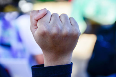 Close-up of hands against blurred background